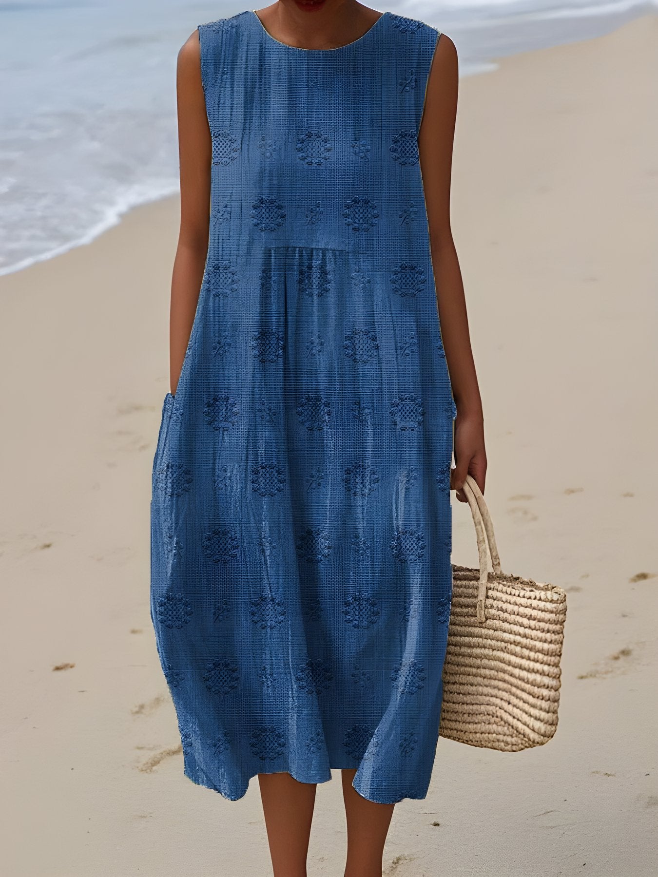 The Frances Cruise Dress in coastal blue textured linen, coastal beach setting