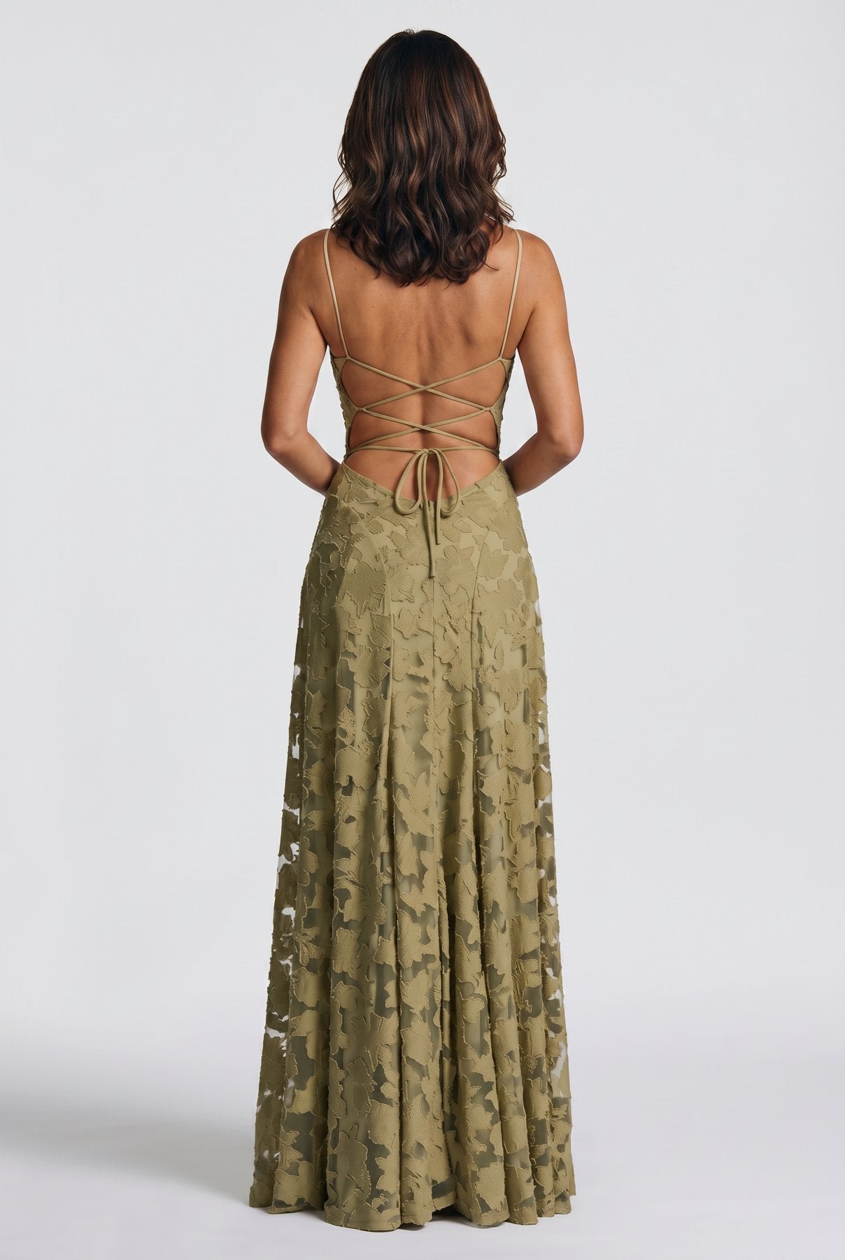 The Cynthia Ceremony Dress in sage olive, back view showing the open lace-up back and floor-length burnout cutwork skirt