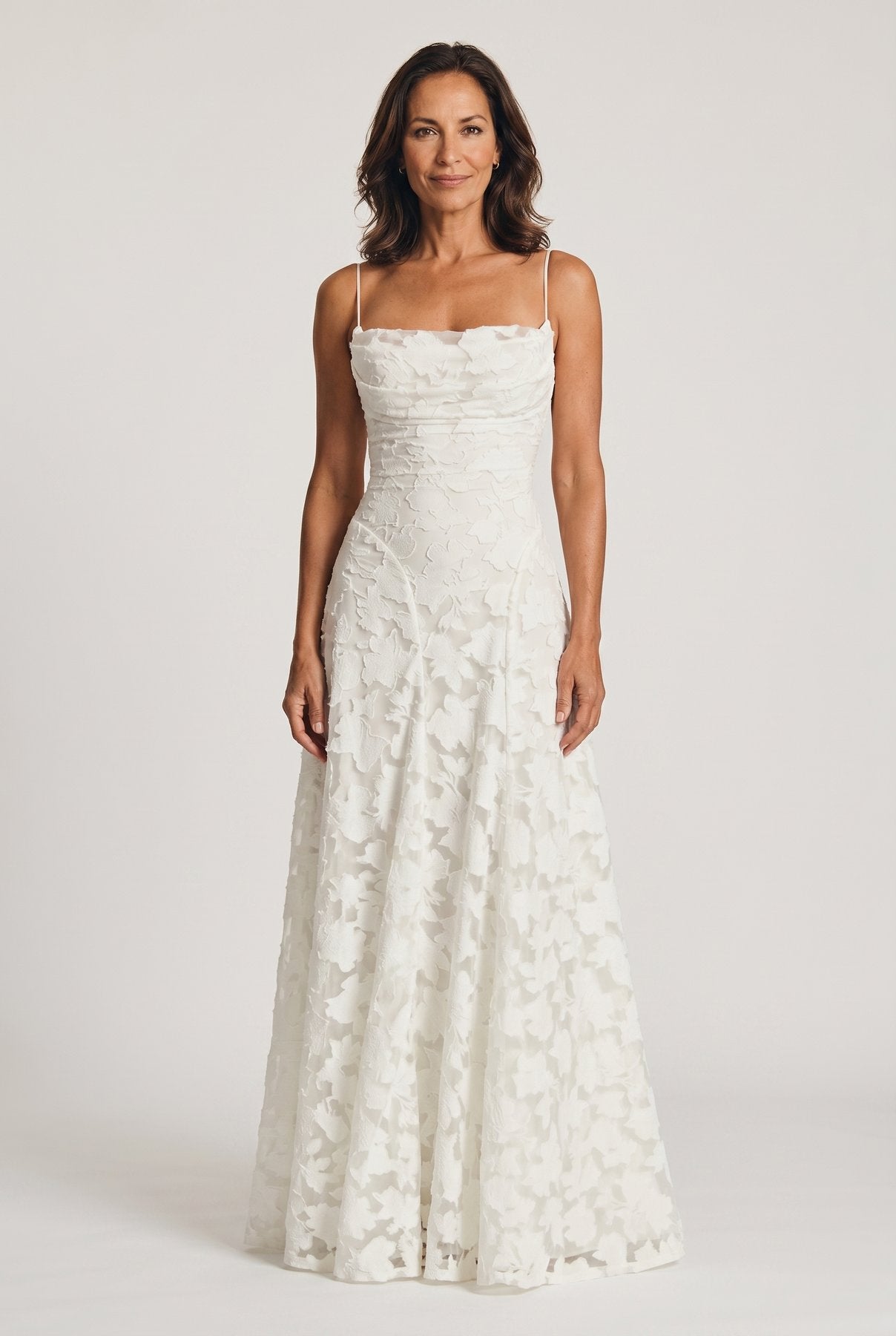 The Cynthia Ceremony Dress in ivory cream burnout floral lace, full-length front view
