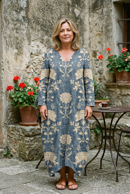 The Deborah Brunch Dress in a shaded Italian garden courtyard, full-length lifestyle