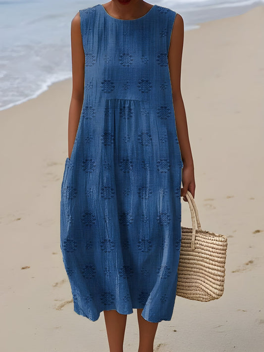 The Frances Cruise Dress in coastal blue textured linen, coastal beach setting