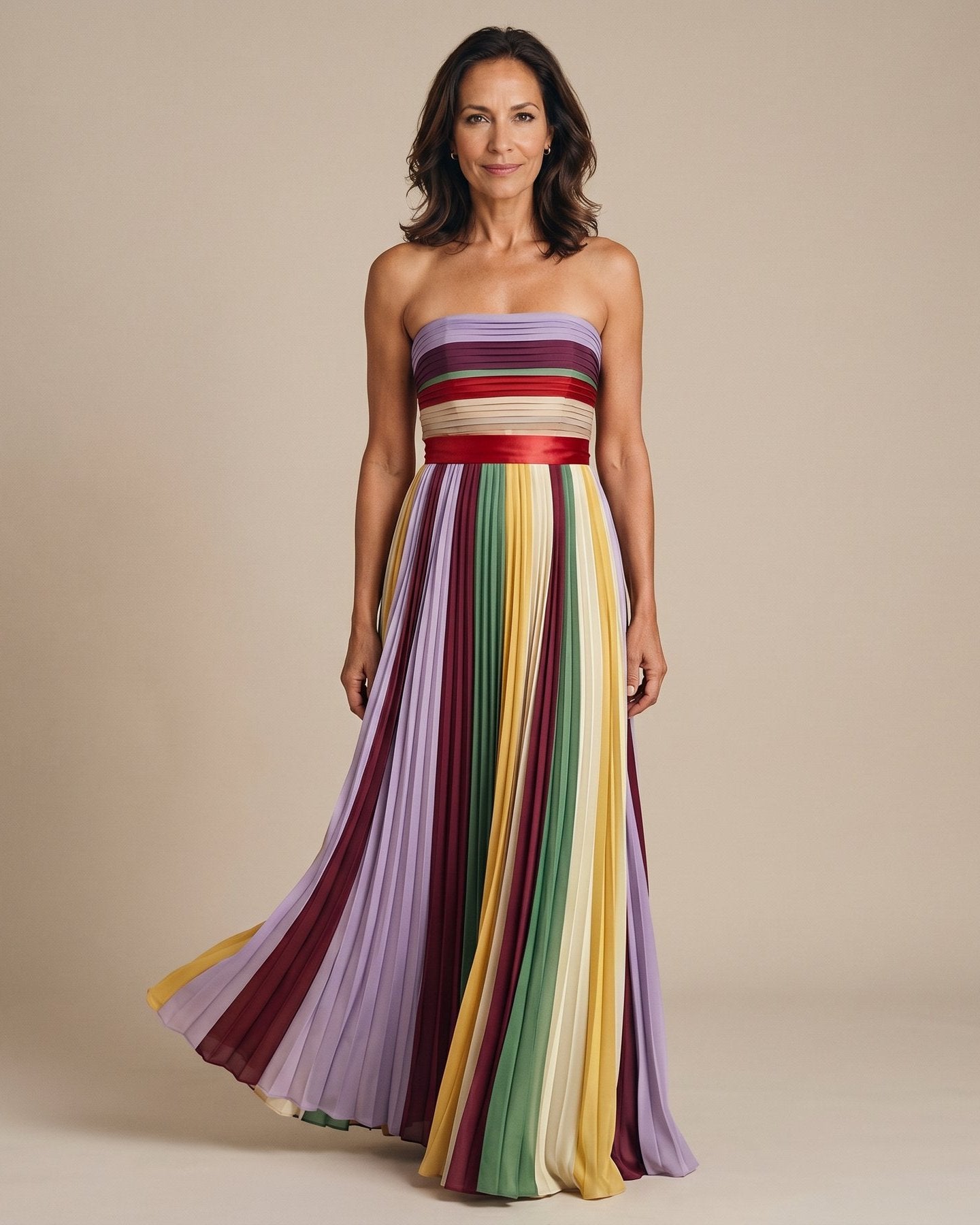 The Rebecca Late Morning Dress in multicolor pleated chiffon with red satin sash at the waist, full-length front view
