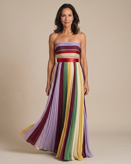 The Rebecca Late Morning Dress in multicolor pleated chiffon with red satin sash at the waist, full-length front view